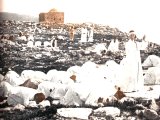 Samaritans assemble before the rock, on the summit of Mount Gerizim, which marks the traditional site of the Holy of Holies of the Samaritan temple destroyed about 120 B.C. An early photograph.